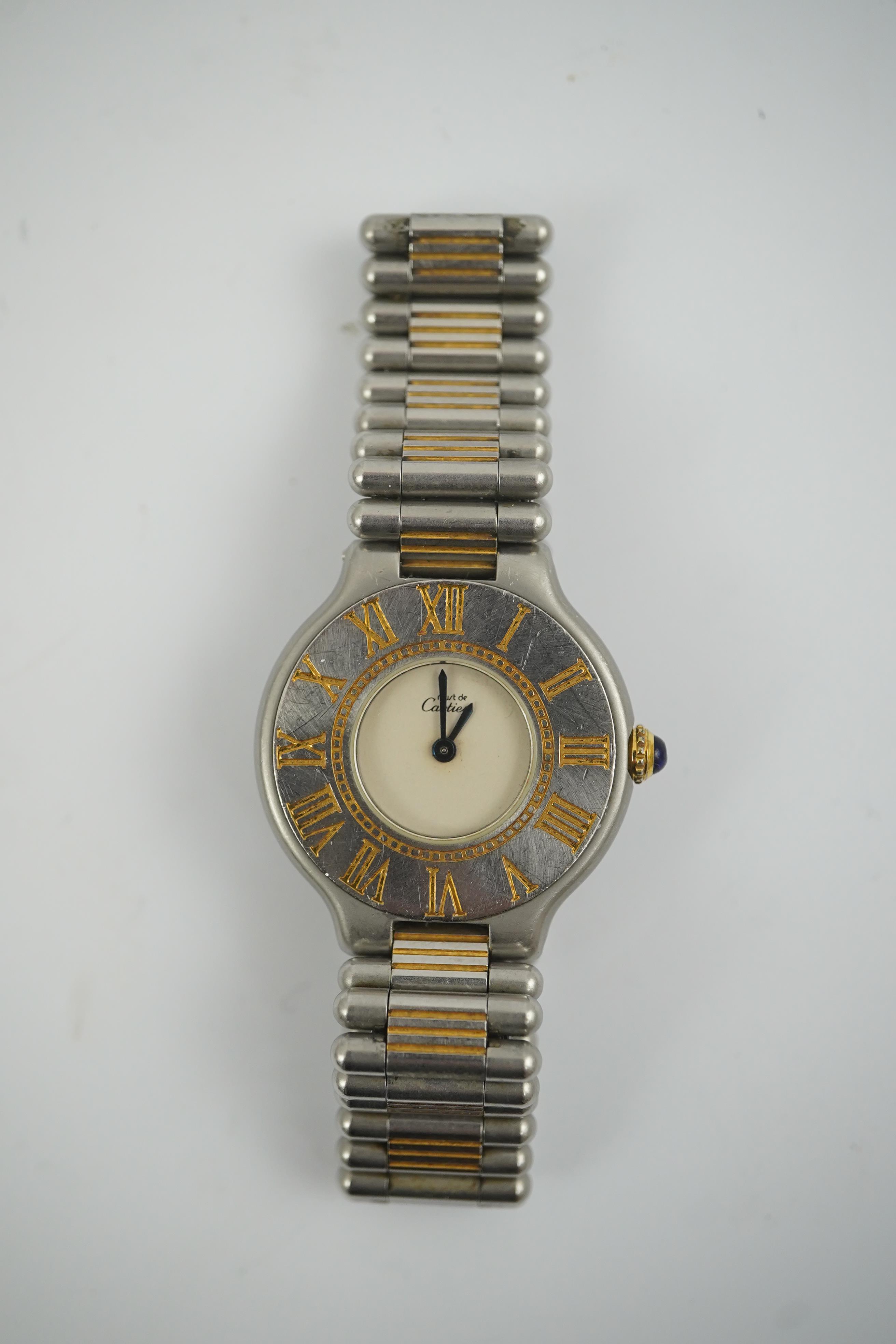 A lady's steel and gold plated Must De Cartier quartz wrist watch, on a steel and gold plated Must De Cartier bracelet